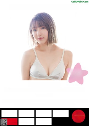 A woman in a white bra smiling at the camera.
