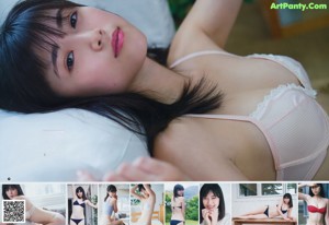A woman in a white bra posing for a picture.