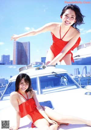 A woman in a red bikini standing on a boat.