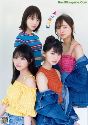 A group of young women standing next to each other.
